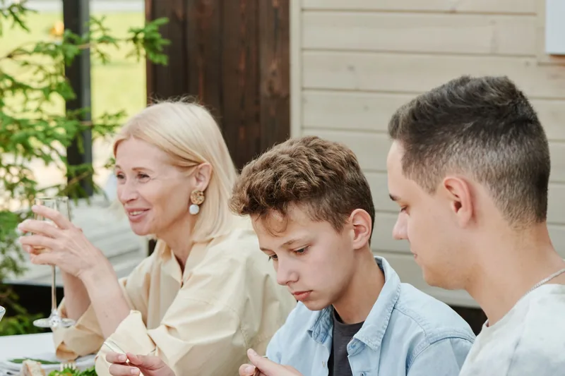 A family eating together at a table outdoors